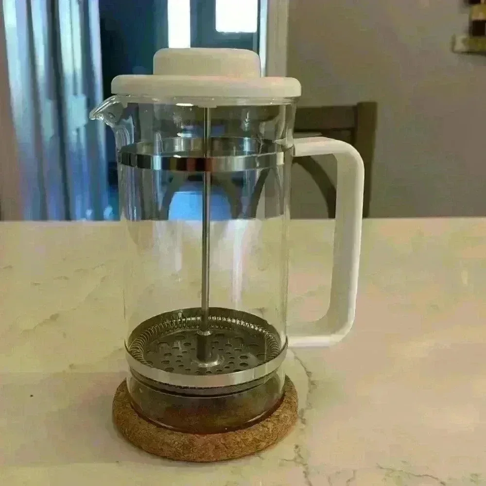Vintage Bodum French press from the 80's with cork coaster